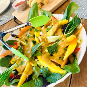 Vegan Thai mango salad with peanut satay dressing served at a UK wedding by Vegan Junkies