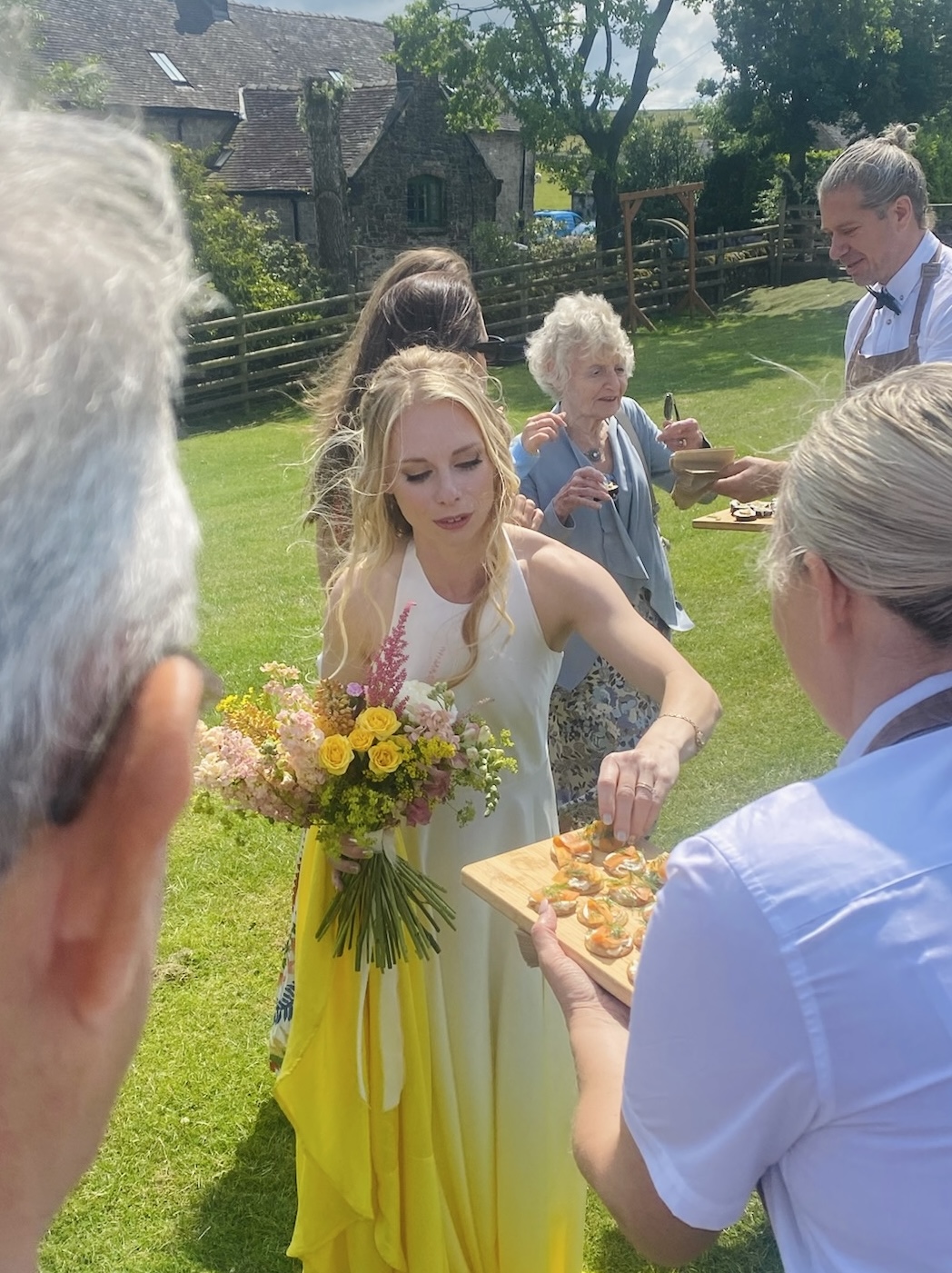 Guests enjoying vegan canapés at a UK wedding catered by Vegan Junkies
